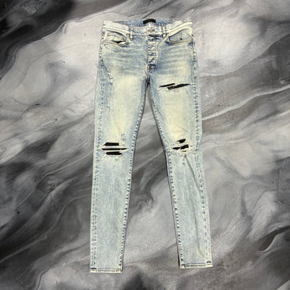 Amiri Light Wash/Black Patch Jean (34)